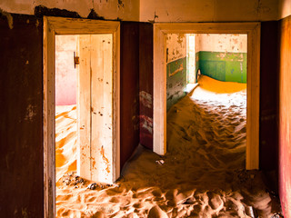 Sand dunes in abandoned house of Kolmanskop ghost town in Namibia, Africa.