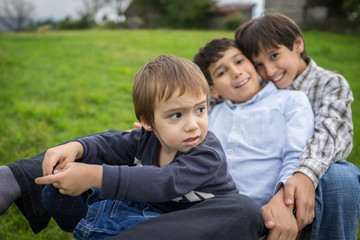 Happy kids on field playing with cart