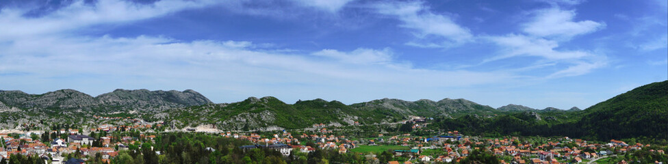 Fototapeta na wymiar Town of Cetinje summer overlooking panoramic shot. Old royal capital in Montenegro, popular touristic destination