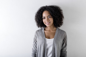 Young trendy woman with curly hair