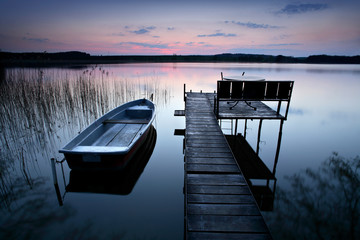 Calm Lake at Sunset, Fishing Boat by Wooden Pier with Bench