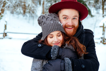 Fototapeta premium beautiful couple in love. Portrait of winter background