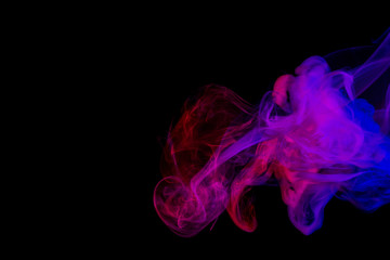 Abstract smoke Weipa. Personal vaporizers fragrant steam. The concept of alternative non-nicotine smoking. Purple pink smoke on a black background. E-cigarette. Evaporator. Taking Close-up. Vaping.