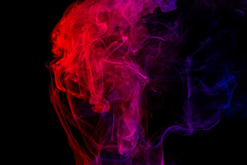 Abstract smoke Weipa. Personal vaporizers fragrant steam. The concept of alternative non-nicotine smoking. Purple pink smoke on a black background. E-cigarette. Evaporator. Taking Close-up. Vaping.