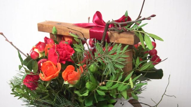 Bouquet flowers in the wooden basket
