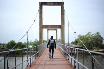 Man and Rak Sa Mae bridge at Rayong ,Thailand