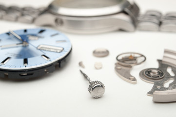 Detail of watch machinery on the table.
