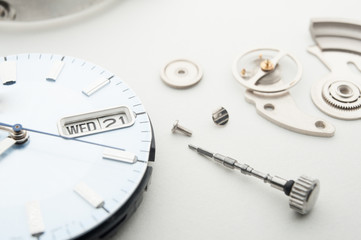 Detail of watch machinery on the table.