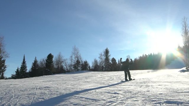 Skier skiing slope on sunny winter day
