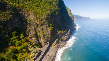 aerial view of waterfall and ocean in Madeira island