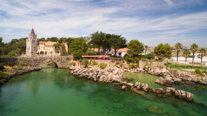 Obraz premium People relax on the beautiful beaches of Cascais Portugal aerial view