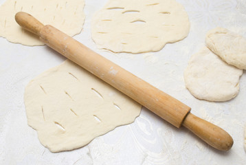 rolling dough with a rolling pin