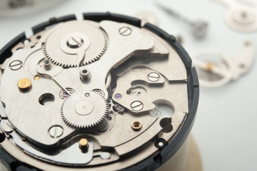 Detail of watch machinery on the table.