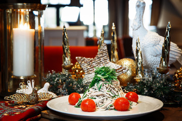 Christmas dinner table with salad and candle