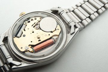 Detail of watch machinery on the table.