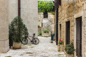 Cyclists in the ancient city. Kotor. Montenegro.