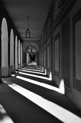 Long Arcade in Munich, Germany. Classical gallery with contrasting geometric shadows in...