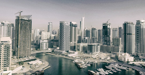 Dubai Marina buildings along artificial canal, aerial view - UAE