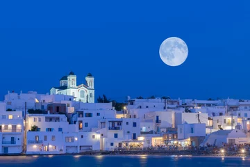 Foto op Canvas Local church of Naoussa village at Paros island in Greece against the full moon.   © Bill Anastasiou