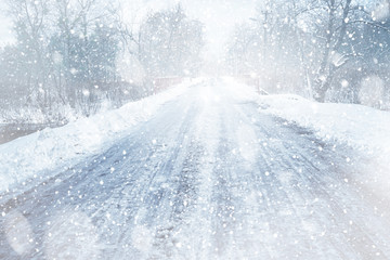 Naklejka premium Countryside road during snow storm