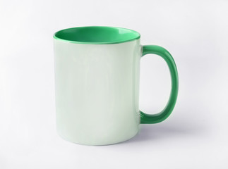 Blank ceramic cup on white background