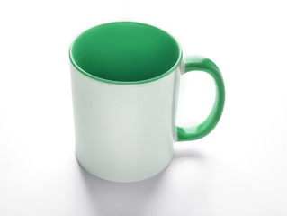 Blank ceramic cup on white background