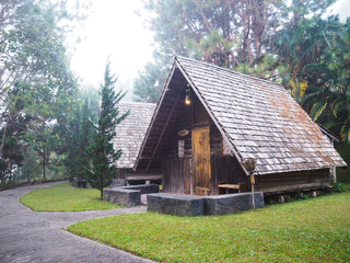 Old vintage wooden cottage in the forest.