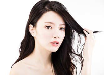Fototapeta premium young Woman touching her Healthy black Hair