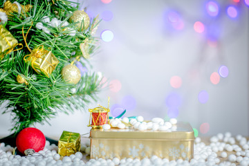 Gift boxes and ornaments in Merry Christmas and Happy New Year concept  with bokeh background, can be use for make a greeting cards.
