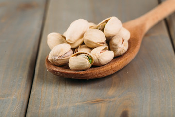 Pistachios on wooden background