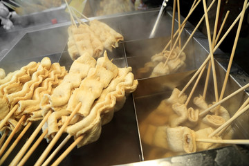 Fish cake skewer, Japanese street food. Hot Oden to stay warm.