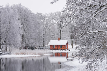 Red house in winter landscape