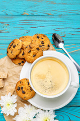 fresh cookies and coffee on wooden background