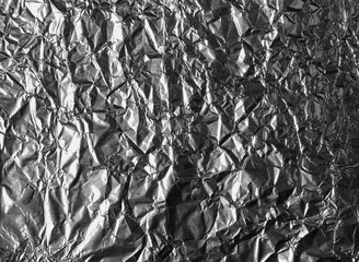 Abstract crumpled silver aluminum foil background texture