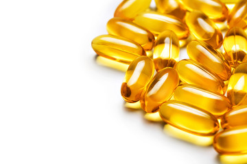 Capsules Omega 3 on white background. Close up, copy space, high resolution product.