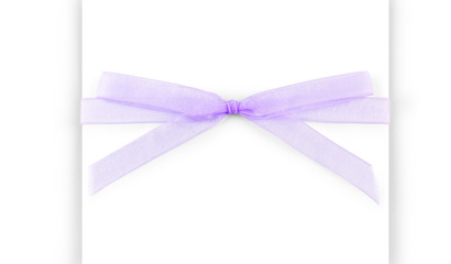 Purple capron ribbon with a bow isolated on white background
