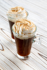 two latte mug on a wooden table