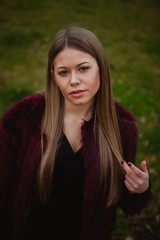 Pretty blonde girl with fur coat