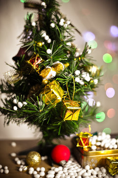 Gift boxes and ornaments in Merry Christmas and Happy New Year concept with bokeh background, can be use for make a greeting cards.