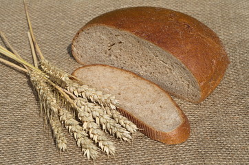Ears of rye and rye bread on burlap