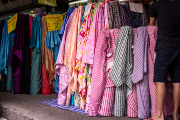 Colorful textile at market. For shopping, industry, sale 