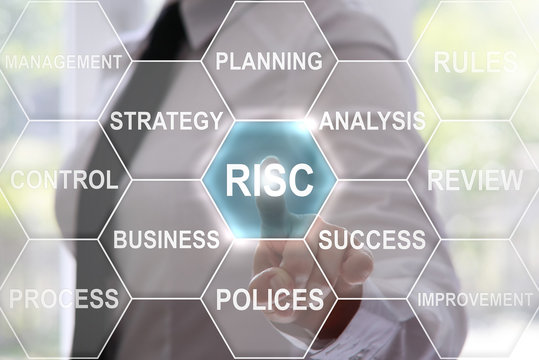 businessman presses risc button on virtual screens. peril concept presented by a consultant in management business on webinar screen. hexagon, technology, concept, business risks, choice of solutions.