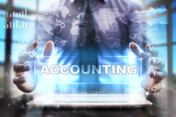 Businessman using tablet pc and selecting accounting.