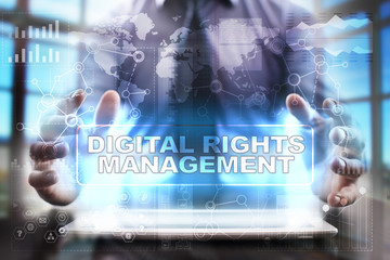 Businessman using tablet pc and selecting digital rights management.