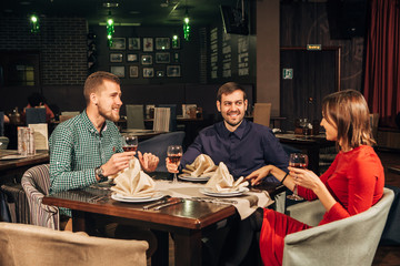 group of friends drinking wine