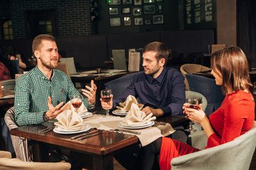 group of friends drinking wine
