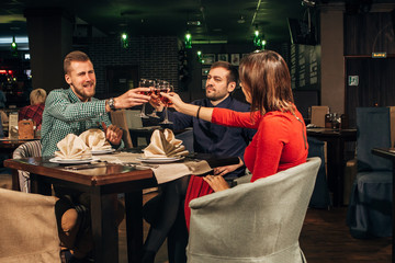 group of friends drinking wine