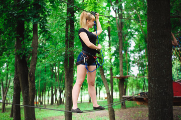 Hiking in the rope park beautiful sports girl