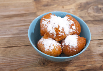 Traditional Dutch oliebollen on wooden background