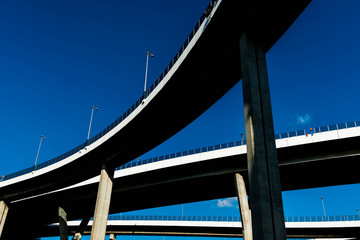 Silhouette of highway ramps on a sunny day